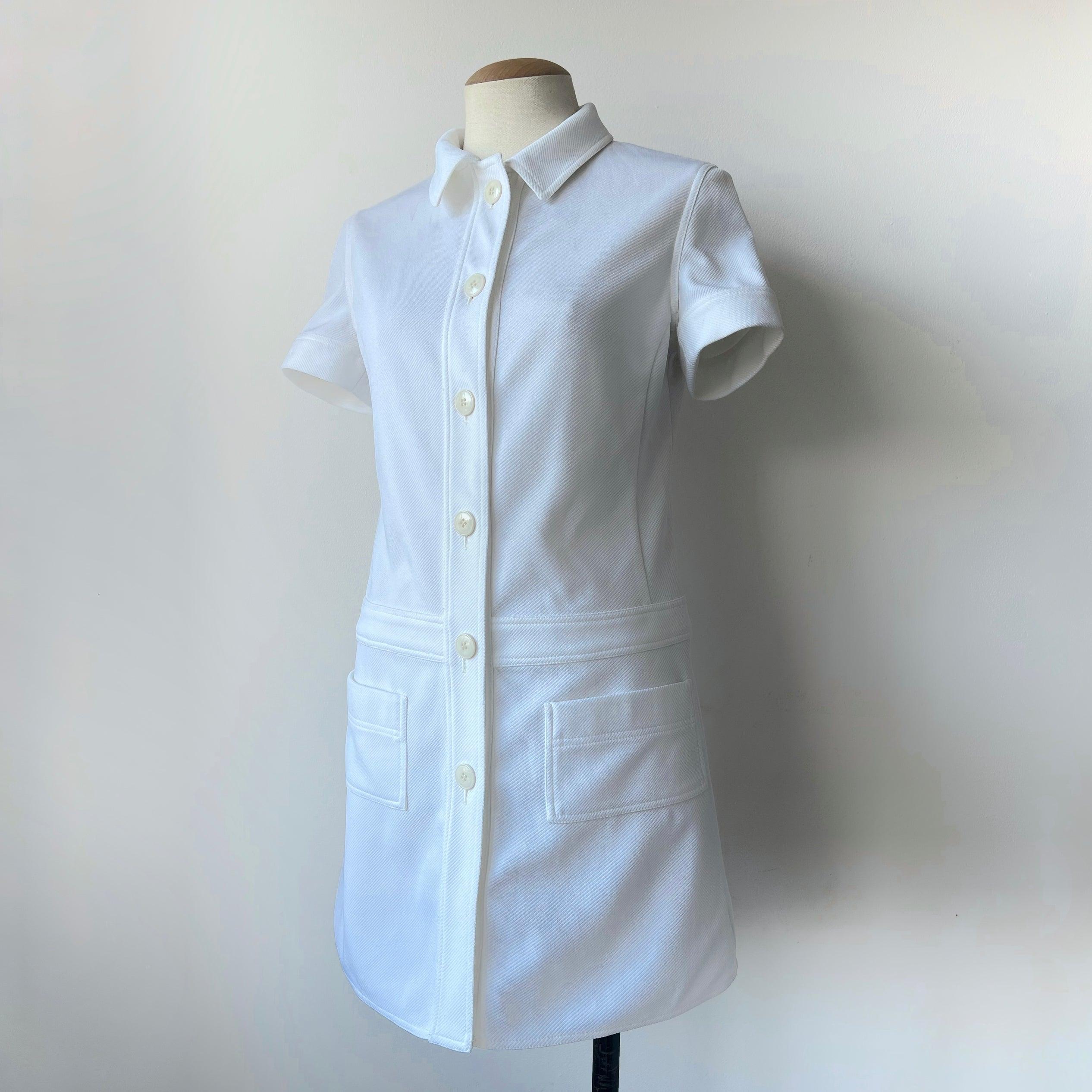 90's Miu Miu white button down dress. Very similar to look 36 of the 1996 runway collection. Which shows an open jacket. But this seems to be from a previous collection that Drew Barrymore modeled in  

Size: size label isn't available. But it fits