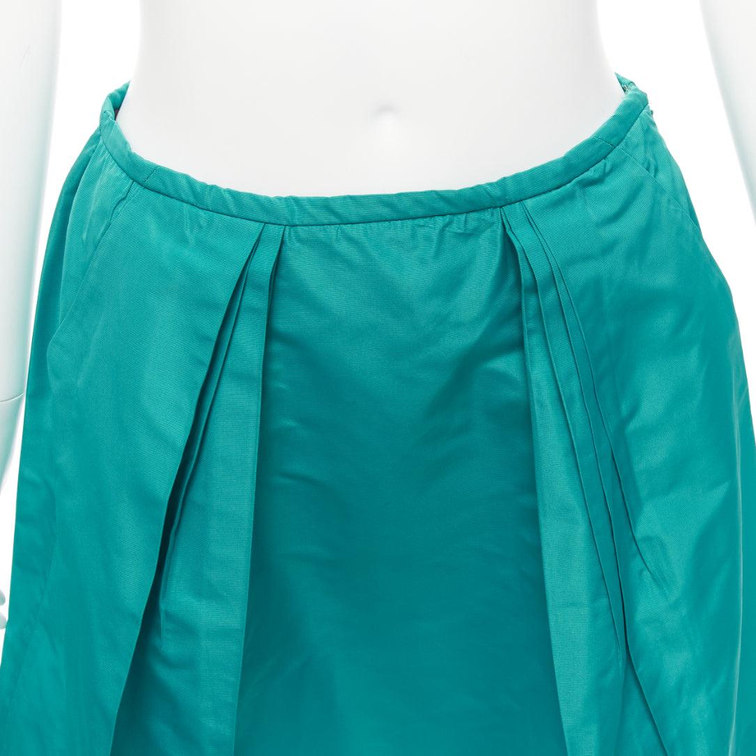 MIU MIU 2007 teal green nylon pleated high waisted Aline skirt IT36 XXS
Reference: MAFK/A00017
Brand: Miu Miu
Designer: Miuccia Prada
Collection: 2007
Material: Polyester, Blend
Color: Green
Pattern: Solid
Closure: Zip
Extra Details: Side zip.
Made