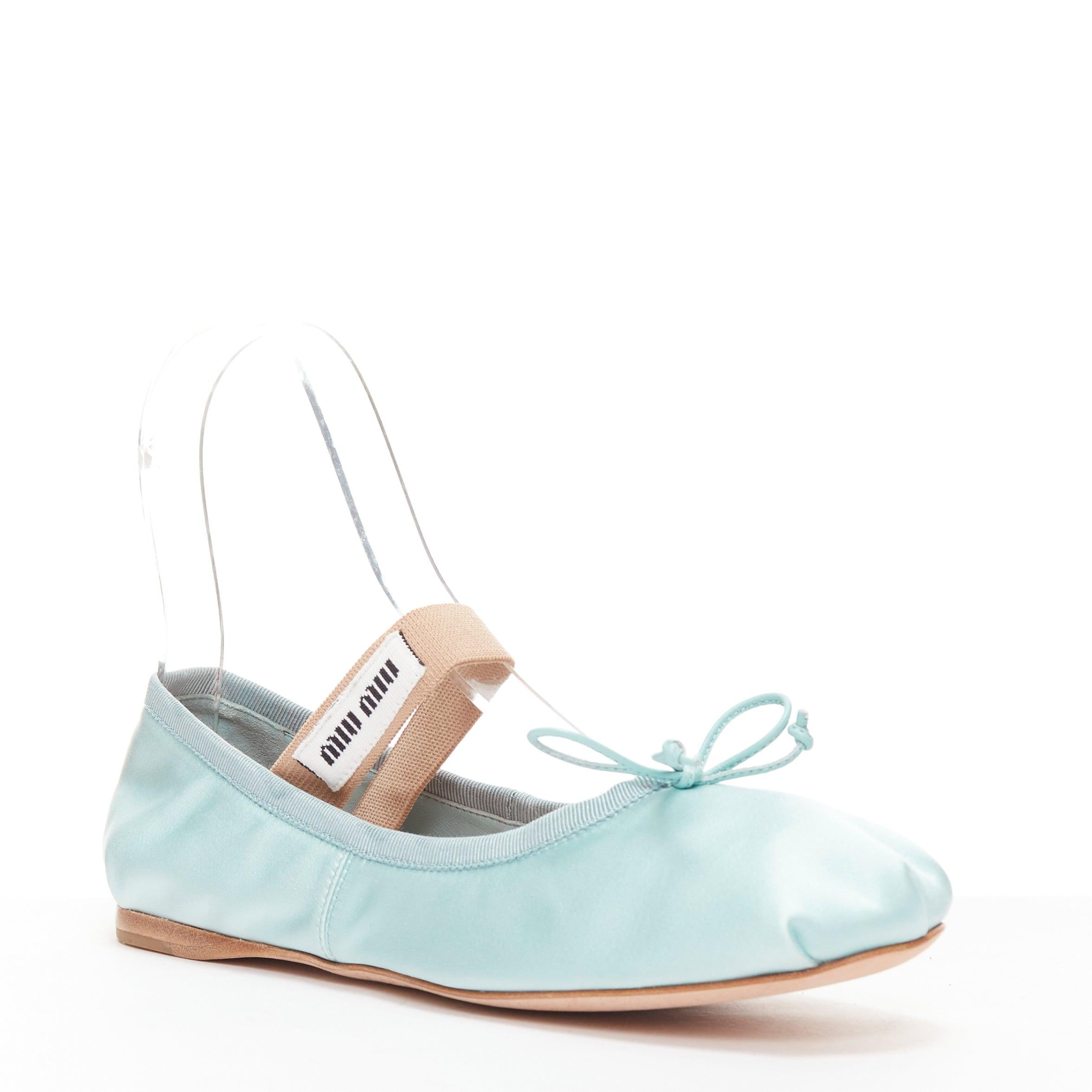 MIU MIU 2022 Runway sky blue satin fabric nude white logo badge Maryjane ballet flats EU37
Reference: KYCG/A00049
Brand: Miu Miu
Designer: Miuccia Prada
Collection: Fall Winter 2022 - Runway
Material: Fabric
Color: Blue, Nude
Pattern: Solid
Closure: