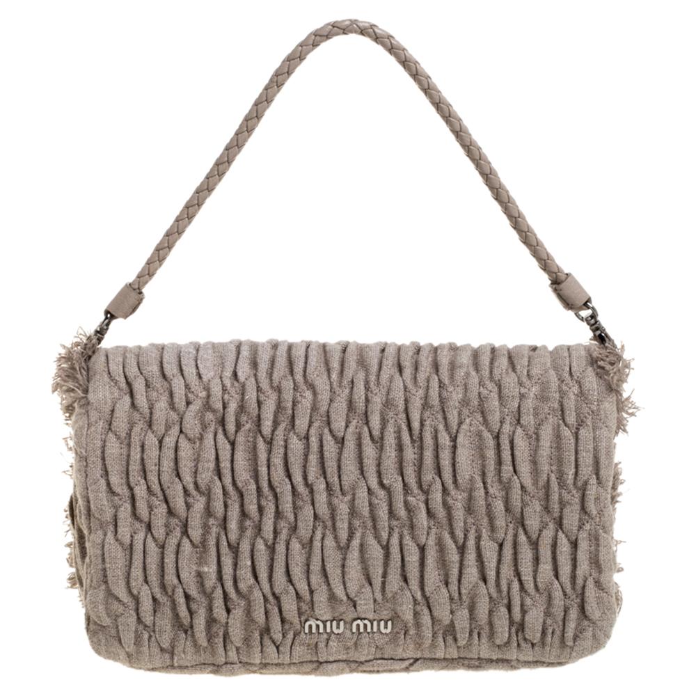 This top-notch and classy bag by Miu Miu will surely leave you spellbound with its simple designs. Casually sling this beige-hued bag to flaunt your contemporary styling choices. Include style to your clothes with this matelasse fabric bag. It is