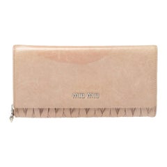 Miu Miu - Portefeuille continental en cuir matelassé beige