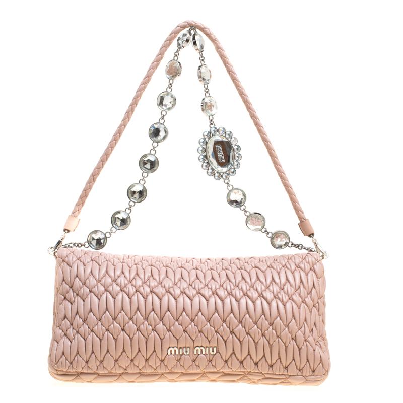 Perfect to swing at special events, this shoulder bag from Miu Miu is a must-have! Crafted from Matelassé leather, the bag features a flap with crystals embellished on the turn lock and a satin-lined interior fitted with a zip pocket for you to