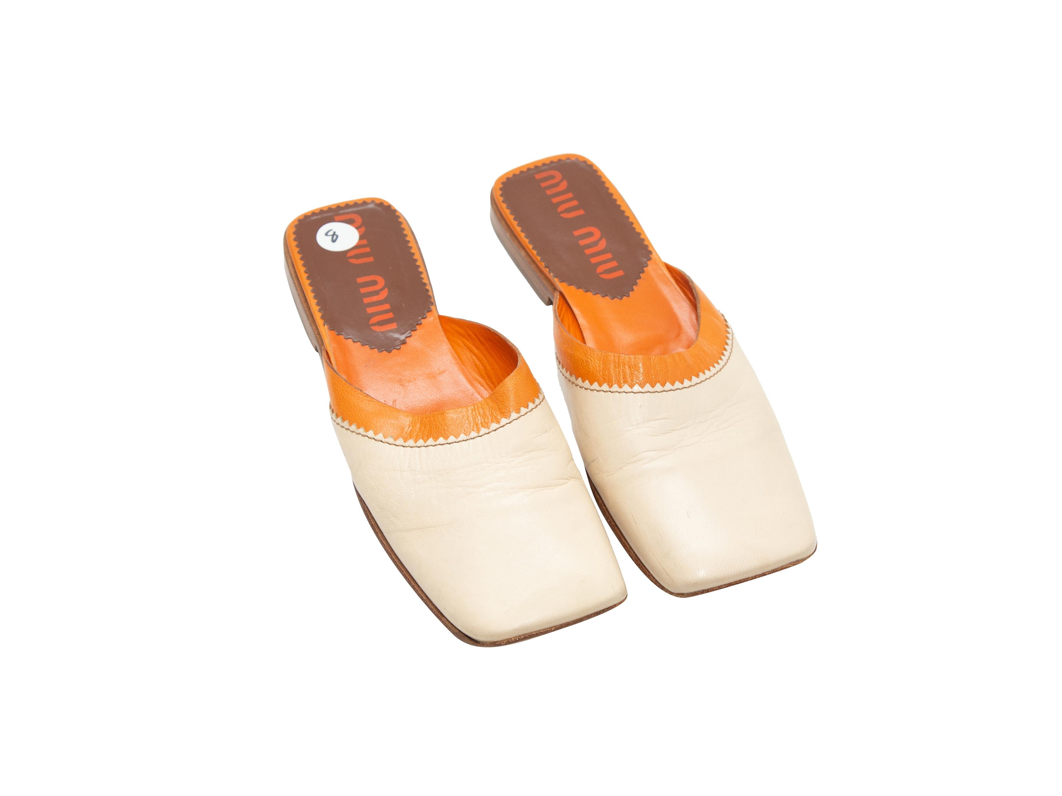 Product details: Vintage beige and orange leather square-toe mules by Miu Miu. Designer size 38. 0.5