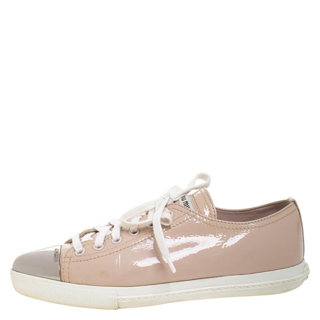 These sneakers from Miu Miu are amazingly stylish! The sneakers have been crafted from patent leather and feature metal cap toes. They come equipped with comfortable leather-lined insoles, laced vamps and tough rubber soles.

Includes: Original