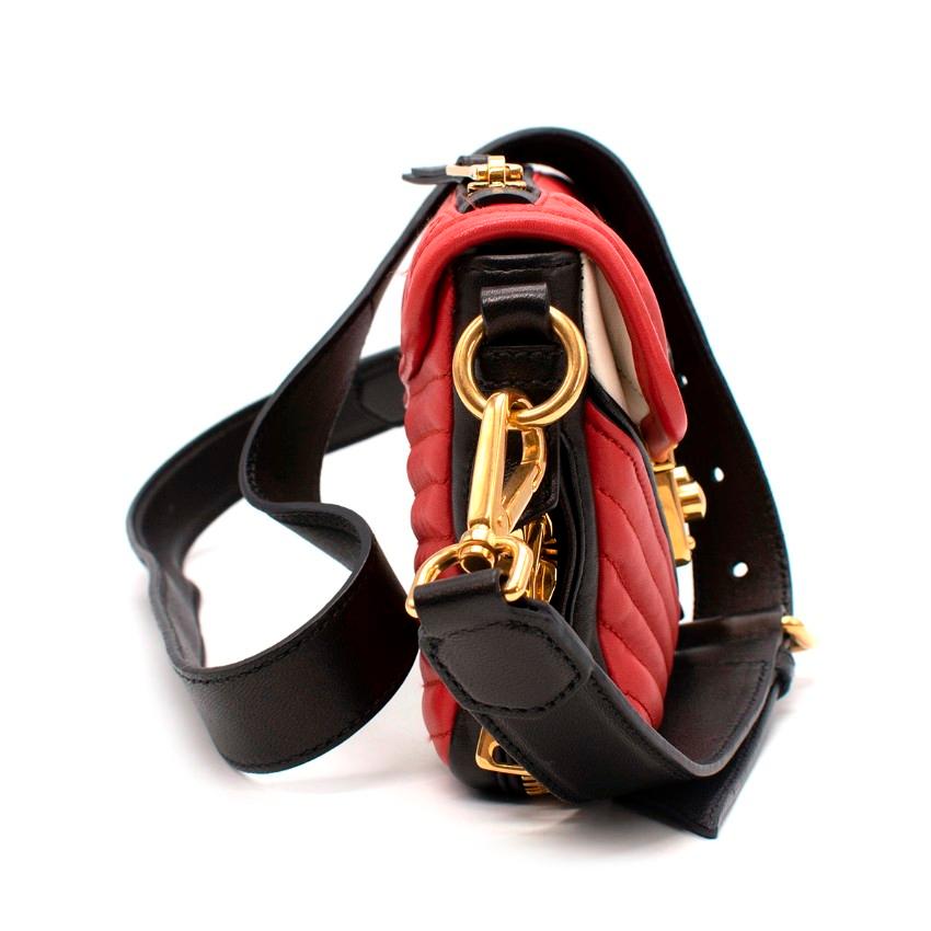 Miu Miu Biker Red & Black Quilted Leather Shoulder Bag
 

 - Resort 2014
 - Tricolour style in red, black & white inspired by motorcycle jacket
 - Decorative quilted leather panels and contrast piping
 - Gold-tone hardware, including branded push