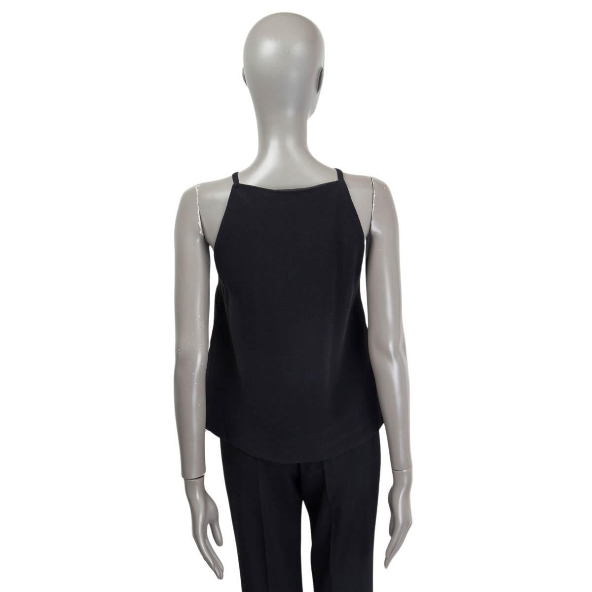100% authentic Miu Miu sleeveless asymmetrical top in black acetate (53%) and viscose (47%). Opens with one push button at the back. Semi-lined in black nylon (100%). Has been worn and is in excellent condition.

Measurements
Tag