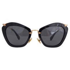 Lunettes de soleil MIU MIU SMU 10N Cat-Eye en acétate noir