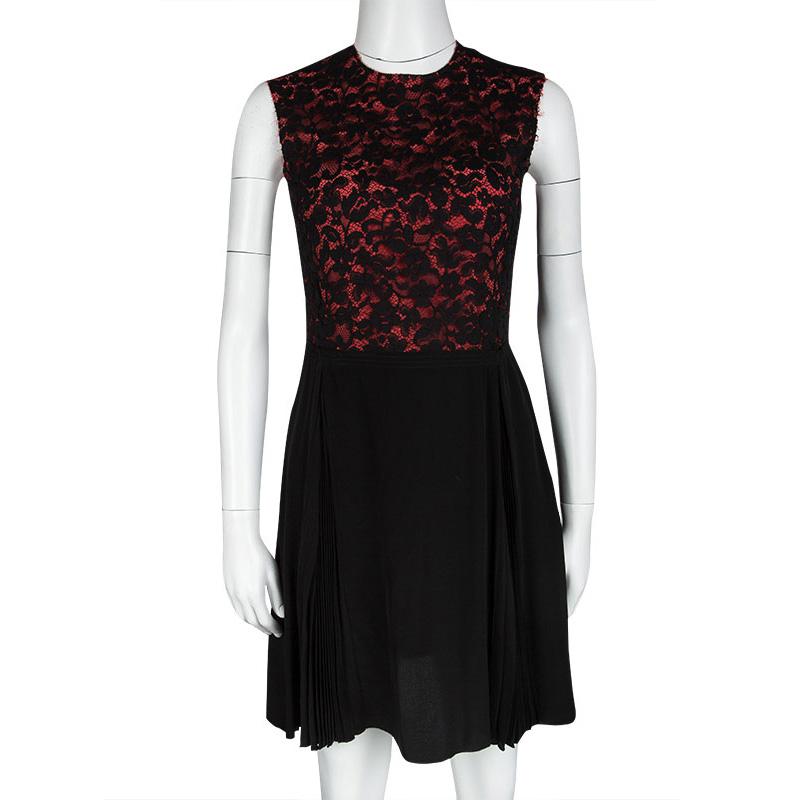 This beautiful Miu Miu dress is a perfect addition to your collection to create the most gorgeous feminine and stylish looks. Constructed in black and orange silk blended fabric, this dress features black floral lace detail at the bodice along with