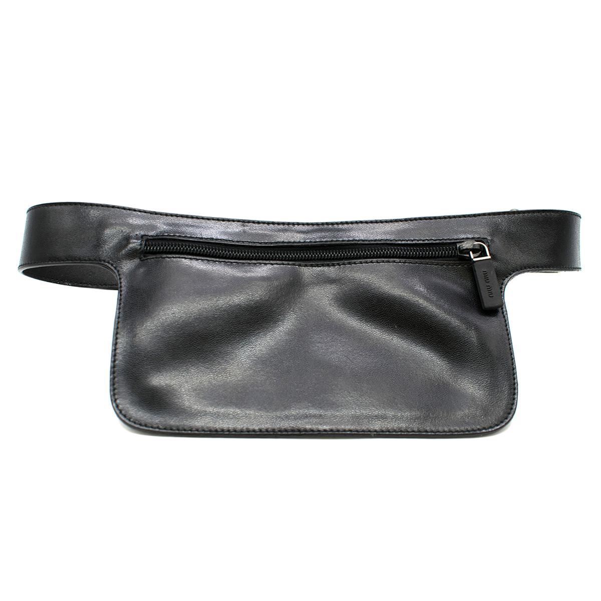 Miu Miu Black Belt Bag

- Black, leather belt bag
- Autogrip buckle, silver-tone hardware
- Two thin pockets: one is bigger with zip fastening, and the other one is smaller with logo embroidered and velcro fastening

Please note, these items are