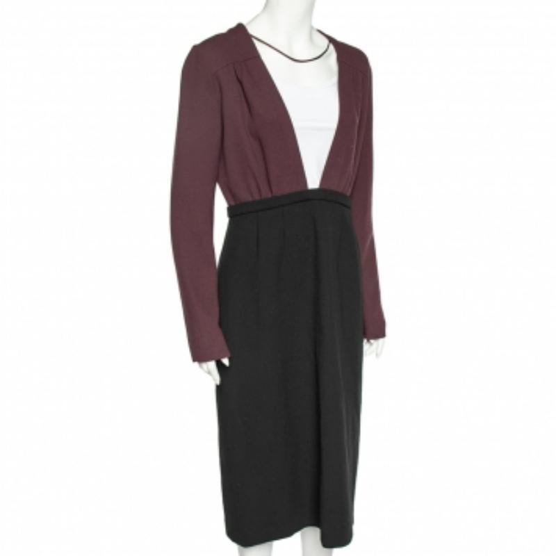 This dress from Miu Miu features a flattering design making it a one-of-a-kind addition to your collection. This midi dress is stitched using black-burgundy textured wool with a plunge neck detail accentuating the front. Match this dress with