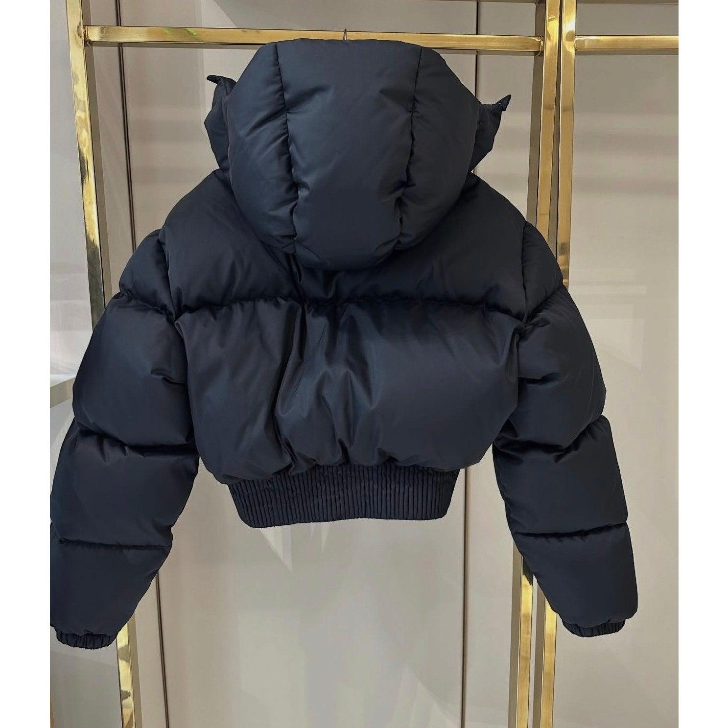 This stylish MIU MIU black cropped puffer jacket is in very good condition and ready to wear! Size 38. 

Features:

- Brand: MIU MIU

- Color: Black

- Style: Puffer, Cropped

- Size: 38

- Material: Polyester

Condition: Very good. No
