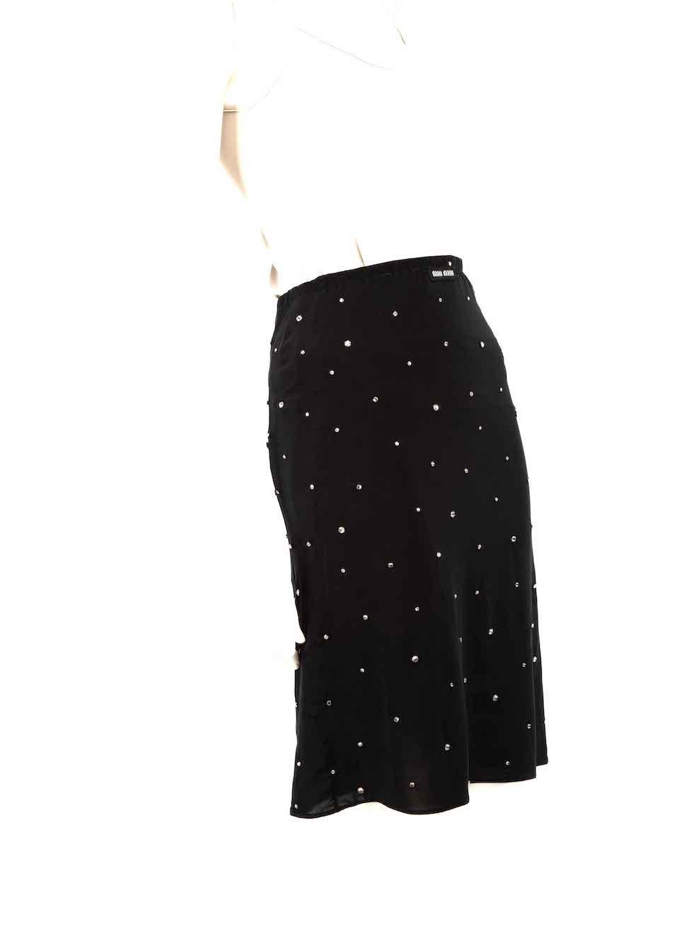 CONDITION is Very good. Minimal wear to skirt is evident. Minimal wear to the sides is seen with pulls to the weave and a small hole in the waistband on this used Miu Miu designer resale item.
 
 
 
 Details
 
 
 Black
 
 Synthetic
 
 Skirt
 
