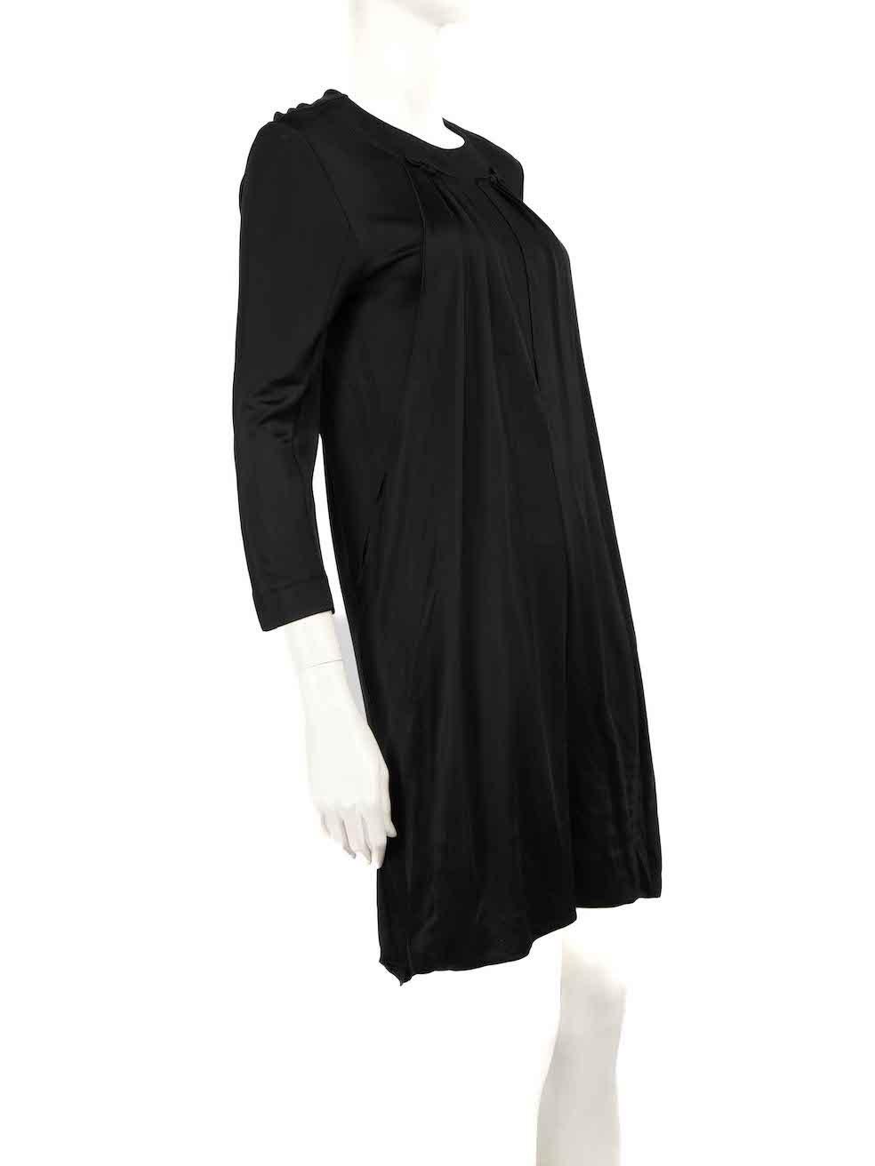 CONDITION is Very good. Minimal wear to dress is evident. The seam is loosened on the back hemline of this used Miu Miu designer resale item.
 
 
 
 Details
 
 
 Black
 
 Viscose
 
 Mini dress
 
 Drape detail on front
 
 Round neckline
 
 Mid