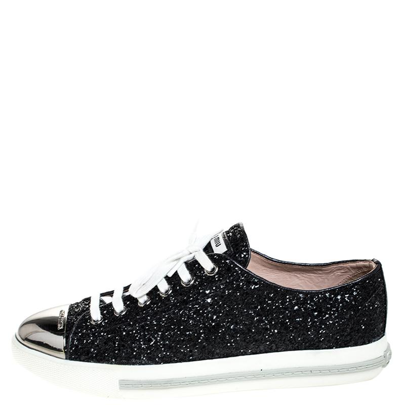 These sneakers from Miu Miu are amazingly stylish! The sneakers have been covered in glitter and feature round metal cap toes. They come equipped with comfortable leather-lined insoles, laced vamps and tough rubber soles.

Includes: The Luxury