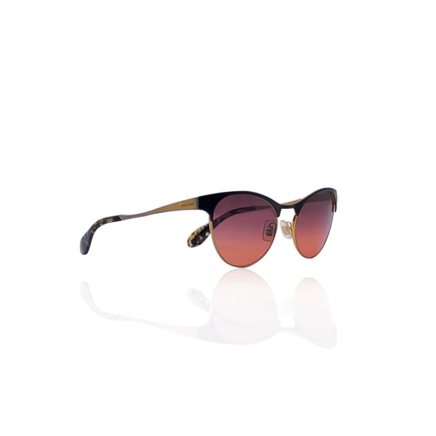 Beautiful sunglasses by Miu MIu, mod. SMU 50 - col.NAL-0A7. Cat- eye shape in black and gold colors. Logo on the temples and gradient purple/pink lenses. Mod & refs.: mod. SMU 50 - col.NAL-0A7 - 54/18 - 140 - 2N. Made in Italy Details MATERIAL:
