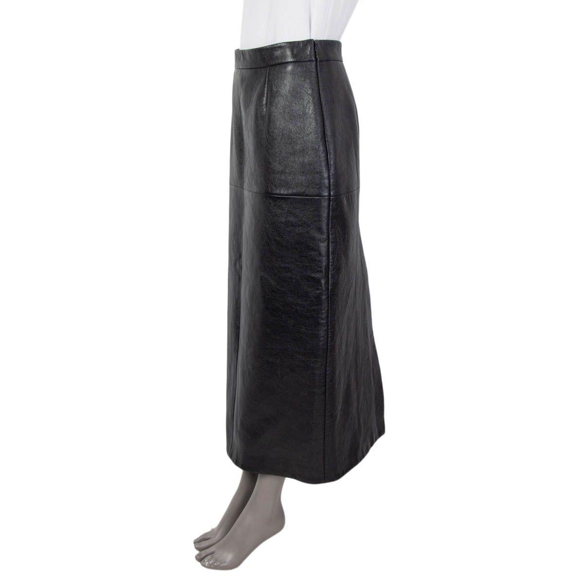 100% authentic Miu Miu paneled high-rise midi skirt in black lambskin (100%). Features a slit at the back. Opens with a concealed zipper and a hook at the side. Lined in black viscose (64%) and polyester (36%). Has been worn and is in excellent