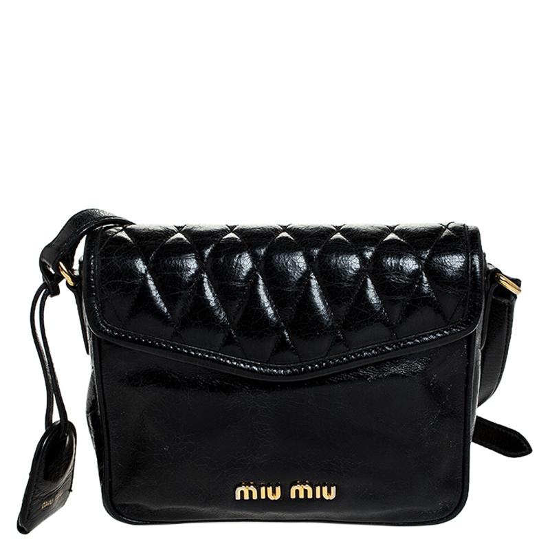 This crossbody bag by Miu Miu is a must-have. It is crafted from leather and comes in a classic shade of black. It is held by a single shoulder strap, features a quilted front flap with a gold-tone closure that opens to a fabric-lined interior with