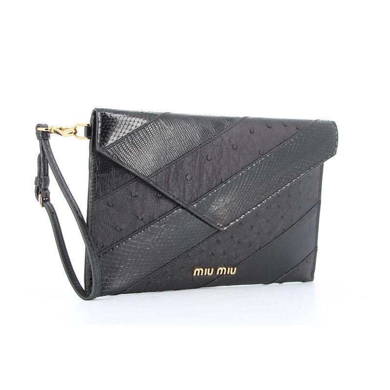 Miu Miu Black lezard/ostricth clutch

Black lezard/ostricth leather, red leather lining, Gold tone metal hardware
one red leather pouch included
Very good condition ,Some light signs of use and wear
Packaging:  Opulence Vintage dust bags

Additional