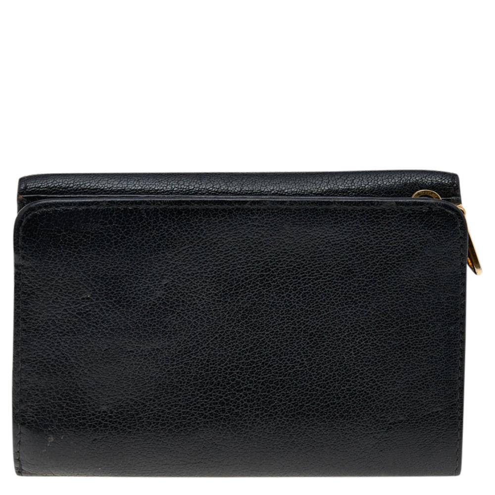 A stylish wallet is an everyday staple for all fashionistas! This compact wallet from the house of Miu Miu is crafted from leather and is equipped with a logo-adorned flap that reveals multiple slots to neatly carry your cash and cards. This