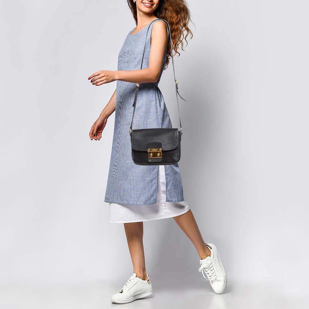 The fashion house's tradition of excellence coupled with modern design sensibilities works to make this Miu Miu bag one of a kind. Its a fabulous accessory for everyday use.