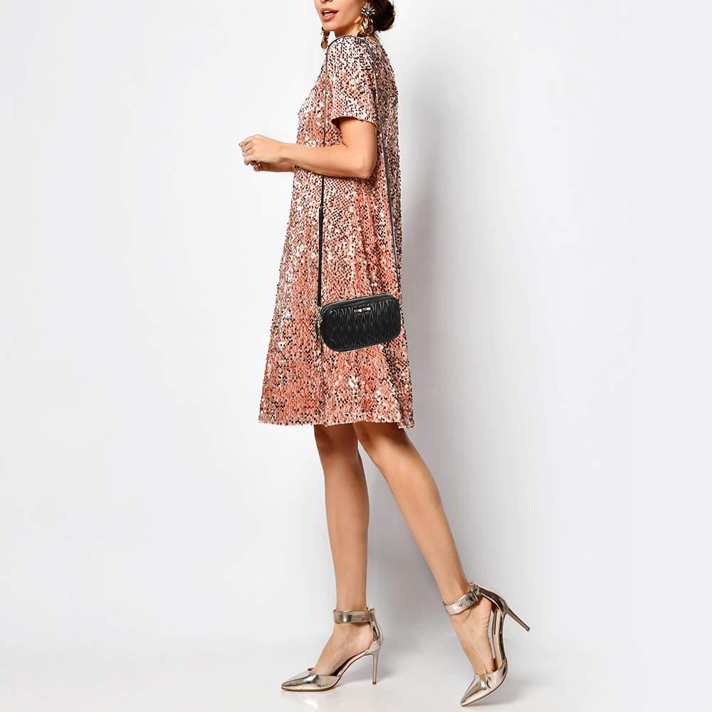 Structured  sophisticated  and stylish are some words that describe this crossbody bag Crafted from best quality material  the creation is adorned with the labels signature appeal  held by comfortable handles  and equipped with a well spaced