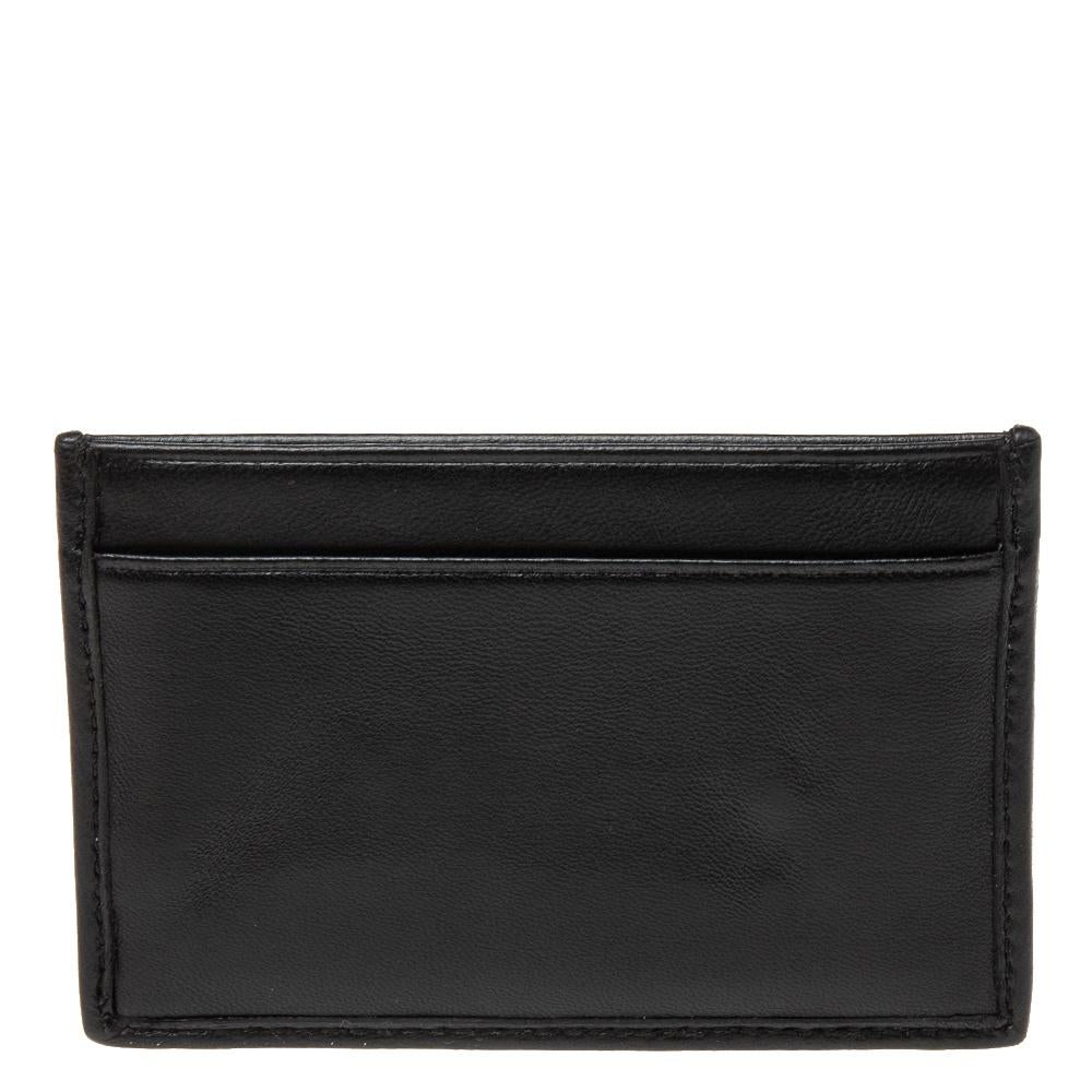 This card holder by Miu Miu is a fine accessory to add to your everyday style edit. Crafted from Matelassé leather, it has a lined interior to hold your things. The embellished brand logo gives it a luxe finish.

Includes: Original Dustbag,