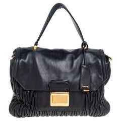 Used Miu Miu Black Matelassé Leather Push Lock Top Handle Bag