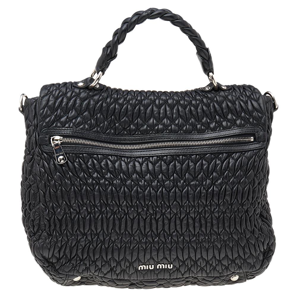 This chic and feminine bag is from Miu Miu and is ideal for daily use. The creation is crafted from matelassé leather and features a flap that opens up to a fabric-lined interior sized to fit your daily essentials. The creation is equipped with a