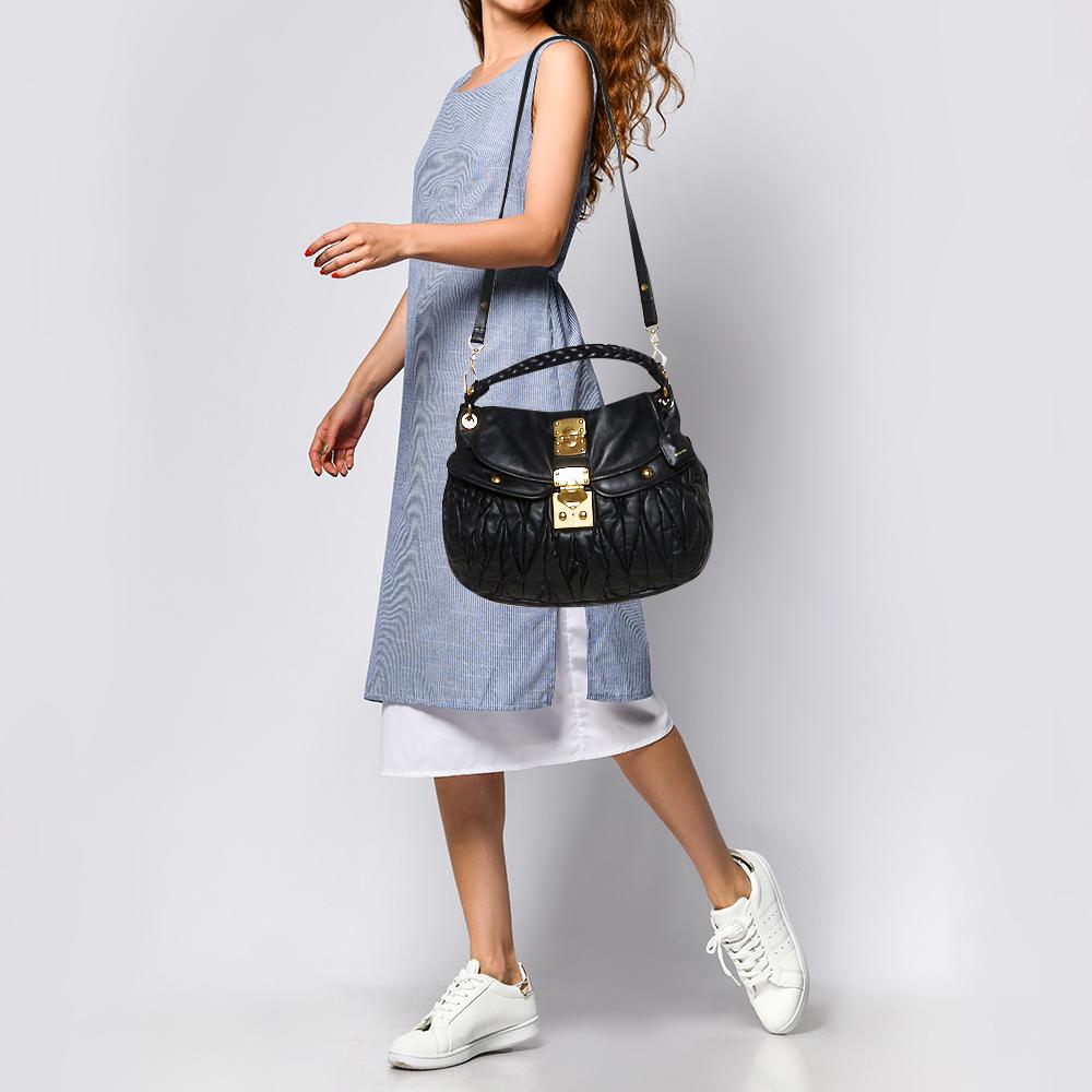 This chic and feminine Coffer hobo is from Miu Miu. The bag is crafted from leather carrying the signature matelasse pattern and features a flap that opens up to a fabric-lined interior sized to fit your daily essentials. The hobo is equipped with a