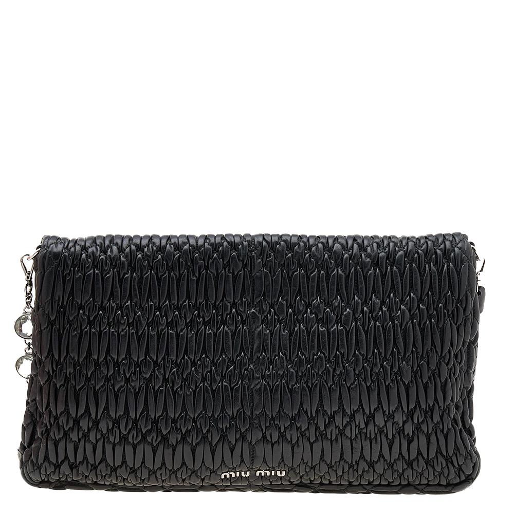 This Miu Miu black bag will be the perfect companion for your next party. Crafted from matelassé Nappa leather, it is adorned with a crystal-embellished shoulder strap and turn-lock. While the fabric-lined interior gives it a functional touch, the