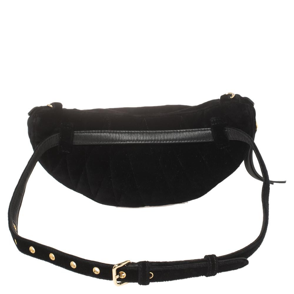 Waist bags are back in style and we are not disappointed! This one from Miu Miu is a fine choice for you to join the trend. Made from black velvet, the bag comes with a waist belt, a gold-tone logo detail at the front, and an optional chain