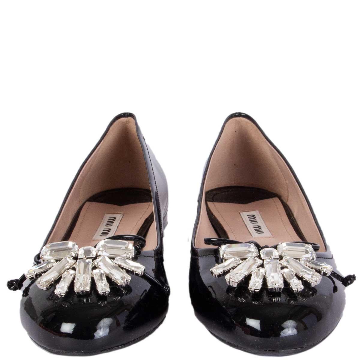 100% authentic Miu Miu ballet flats in black patent leather embellished with Swarovski crystals at tip. Brand new. Come with dust bag. 

Imprinted Size	37
Shoe Size	37
Inside Sole	24cm (9.4in)
Width	7.5cm (2.9in)
Heel	1.5cm