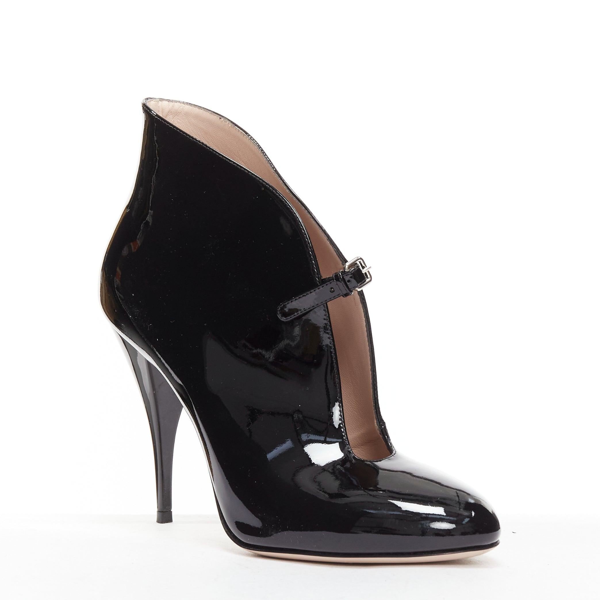 MIU MIU black patent leather low cut vamp ankle booties EU38
Reference: BSHW/A00165
Brand: Miu Miu
Designer: Miuccia Prada
Material: Patent Leather
Color: Black
Pattern: Solid
Closure: Buckle
Lining: Nude Leather
Made in: