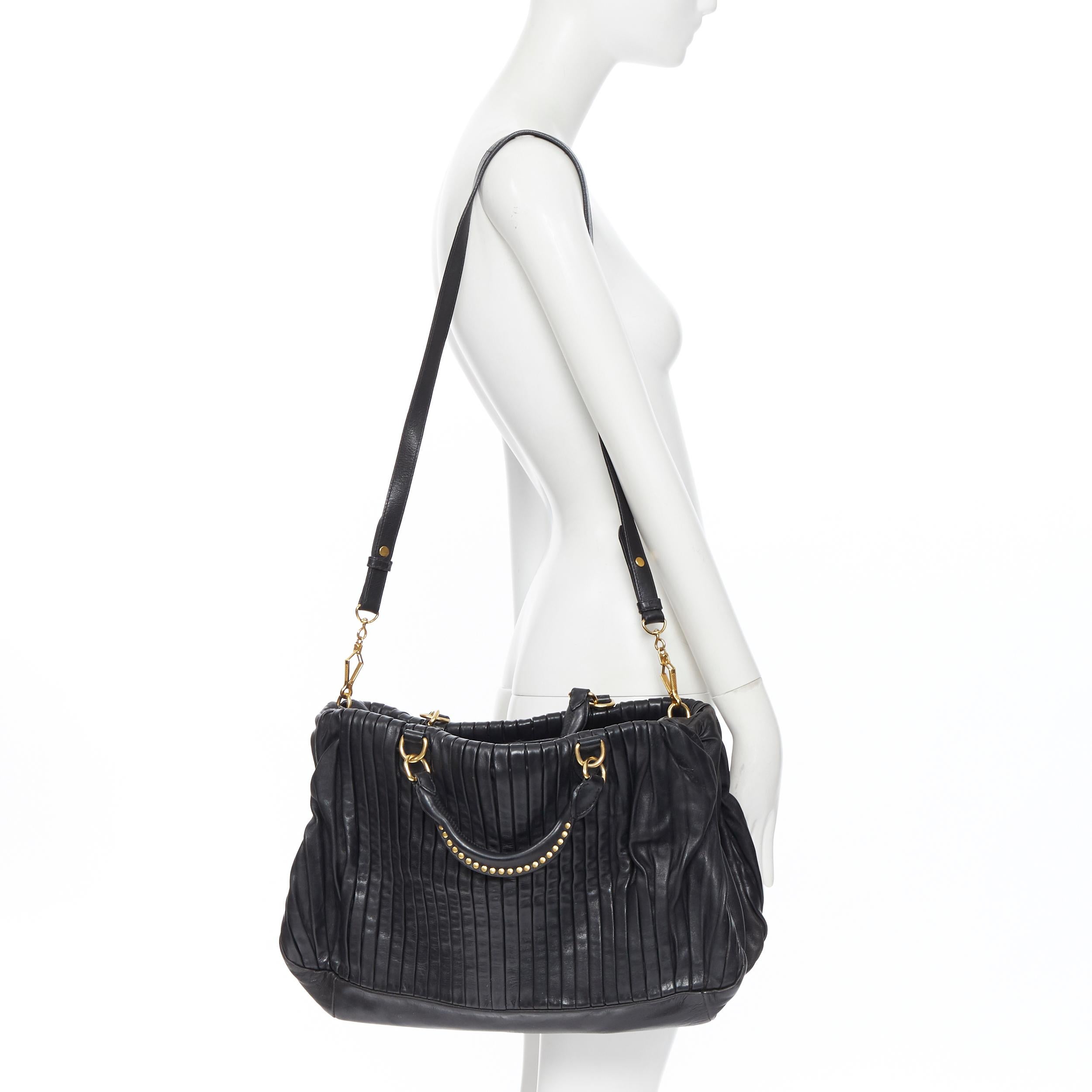 MIU MIU black pleated leather gold studded handle top zip shoulder strap bag
Brand: Miu Miu 
Model Name / Style: Pleated leather bag
Material: Leather
Color: Black
Pattern: Solid
Closure: Zip
Extra Detail: Removable shoulder strap. Studded rolled