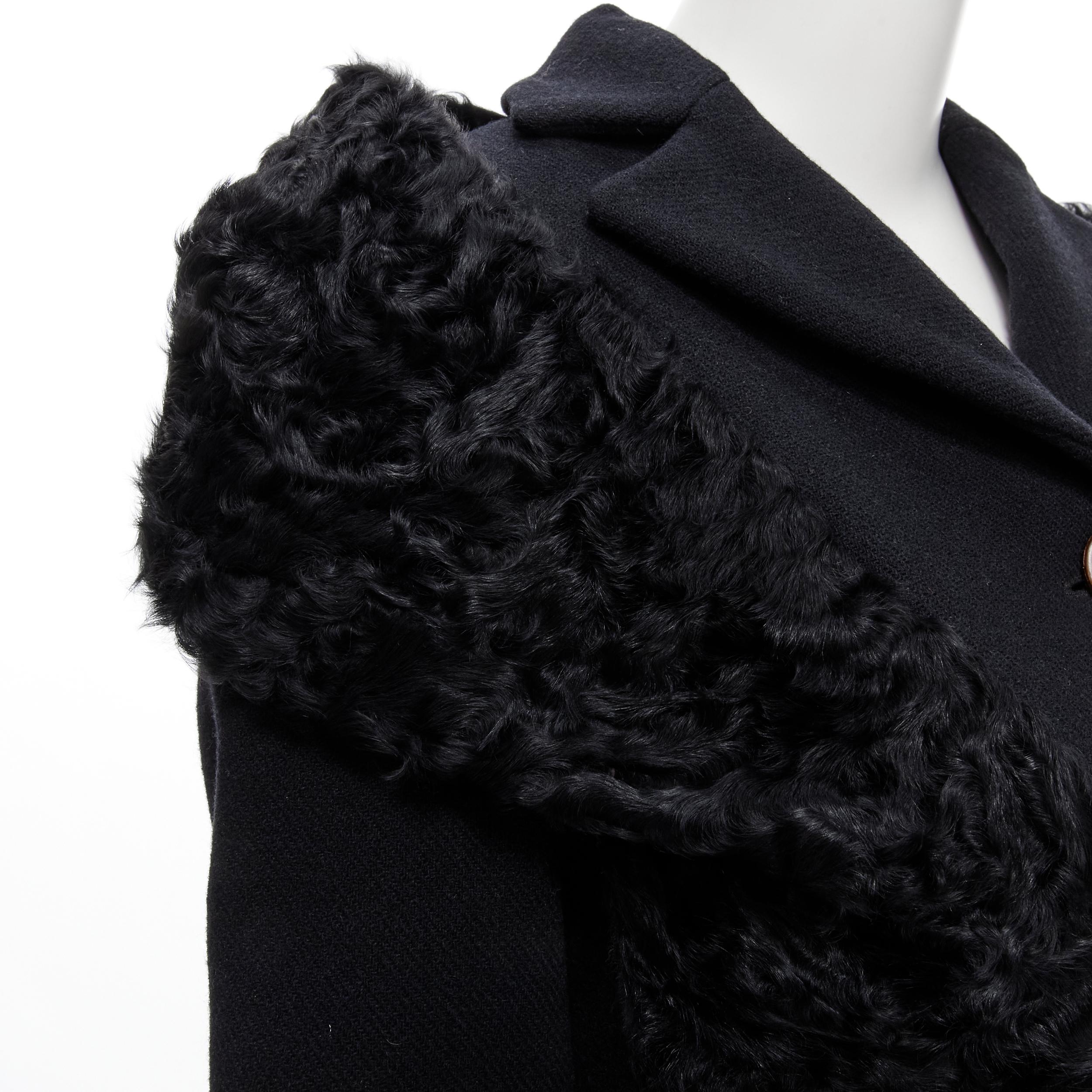 MIU MIU black shearling attached fur shawl long wool coat IT38 XS 
Reference: CELG/A00052 
Brand: Miu Miu 
Designer: Miuccia Prada 
Material: Wool 
Color: Black 
Pattern: Solid 
Closure: Button 
Extra Detail: Fur front panel that becomes an off