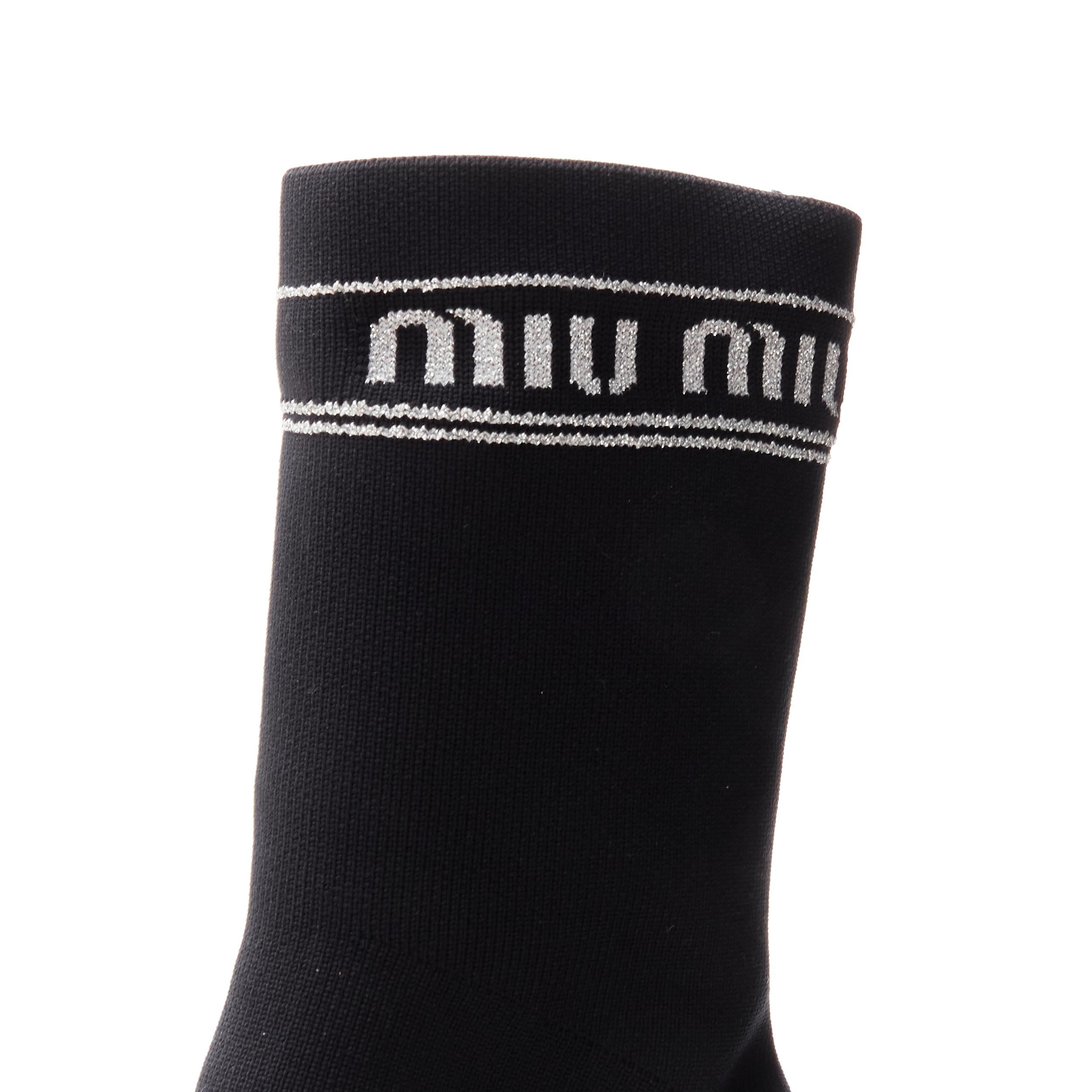 MIU MIU black silver logo sock knit point toe kitten heel bootie EU36.5 
Reference: ANWU/A00377 
Brand: Miu Miu 
Material: Sock 
Color: Black 
Pattern: Solid 
Extra Detail: Stretch fit. Metallic silver Miu Miu logo intarsia. 
Made in: Italy