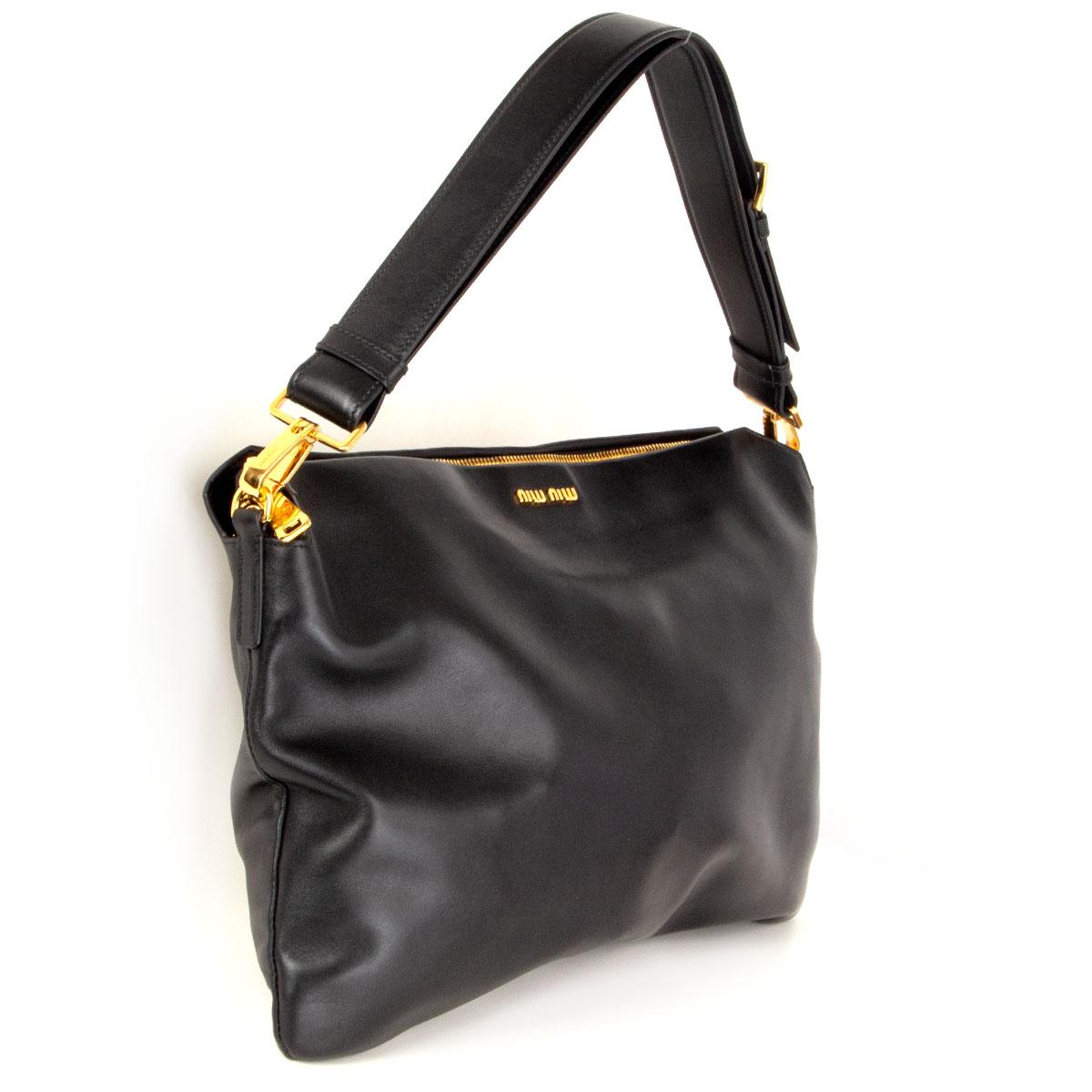 100% authentic Miu Miu 'Cloud' hobo bag in Nero (black) Soft Calf leather featuring gold-tone hardware. Opens with a chunky zipper on top and is lined in red and black leather with one zipper pocket against the back and one open pocket against the