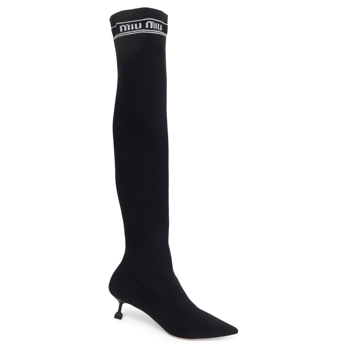 100% authentic Miu Miu kitten heel pointed-toe knee-high strechy sock boots in black fabric with silver lurex logo stitching on the side. Brand new. Come with dust bags. 

Measurements
Imprinted Size	38.5
Shoe Size	38.5
Inside Sole	25.5cm