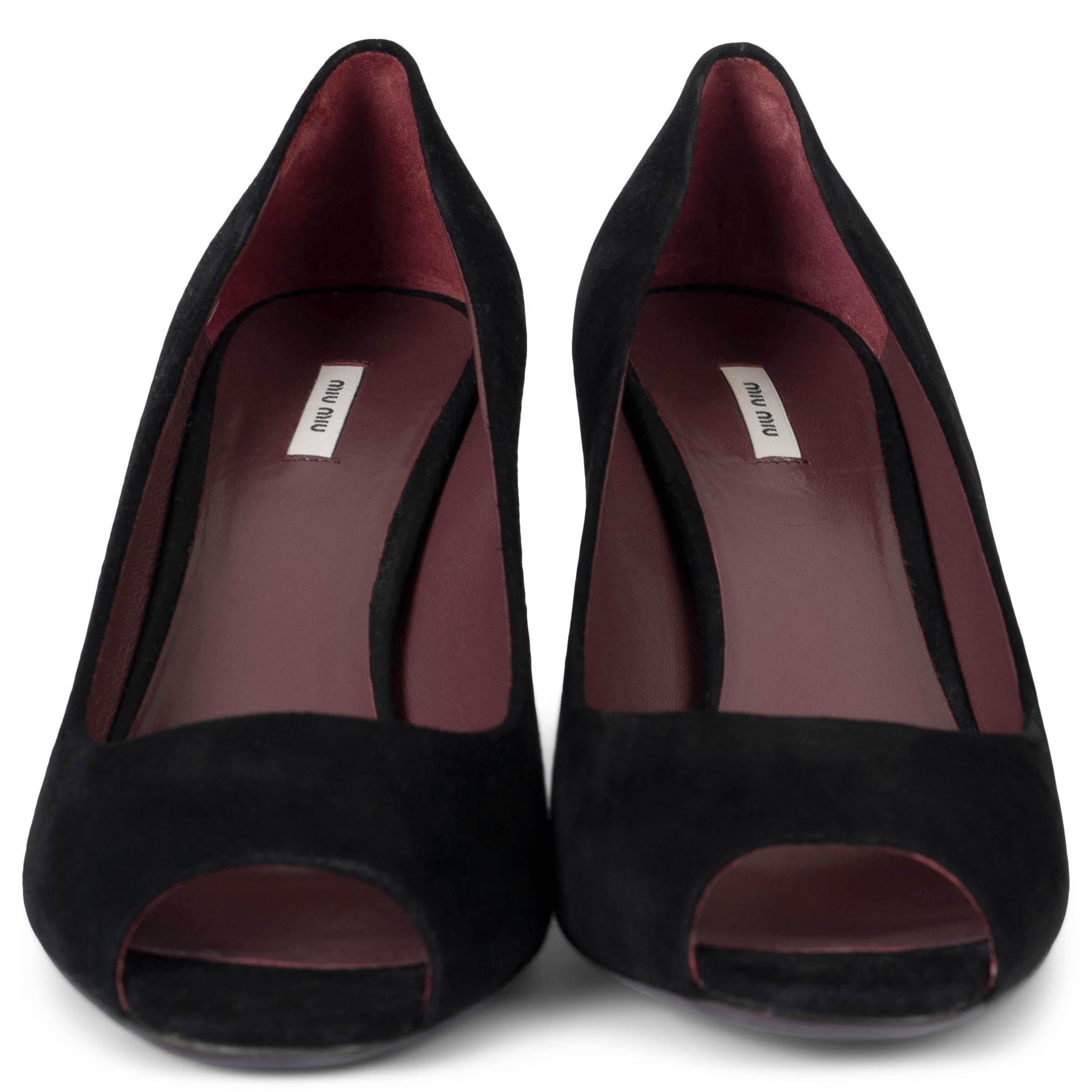 These 100% authentic Miu Miu classic peep toe pumps are crafted from luxurious black suede. Featuring a timeless peep toe design, they offer a sophisticated and elegant look that's perfect for any occasion. Have been worn once and are in excellent