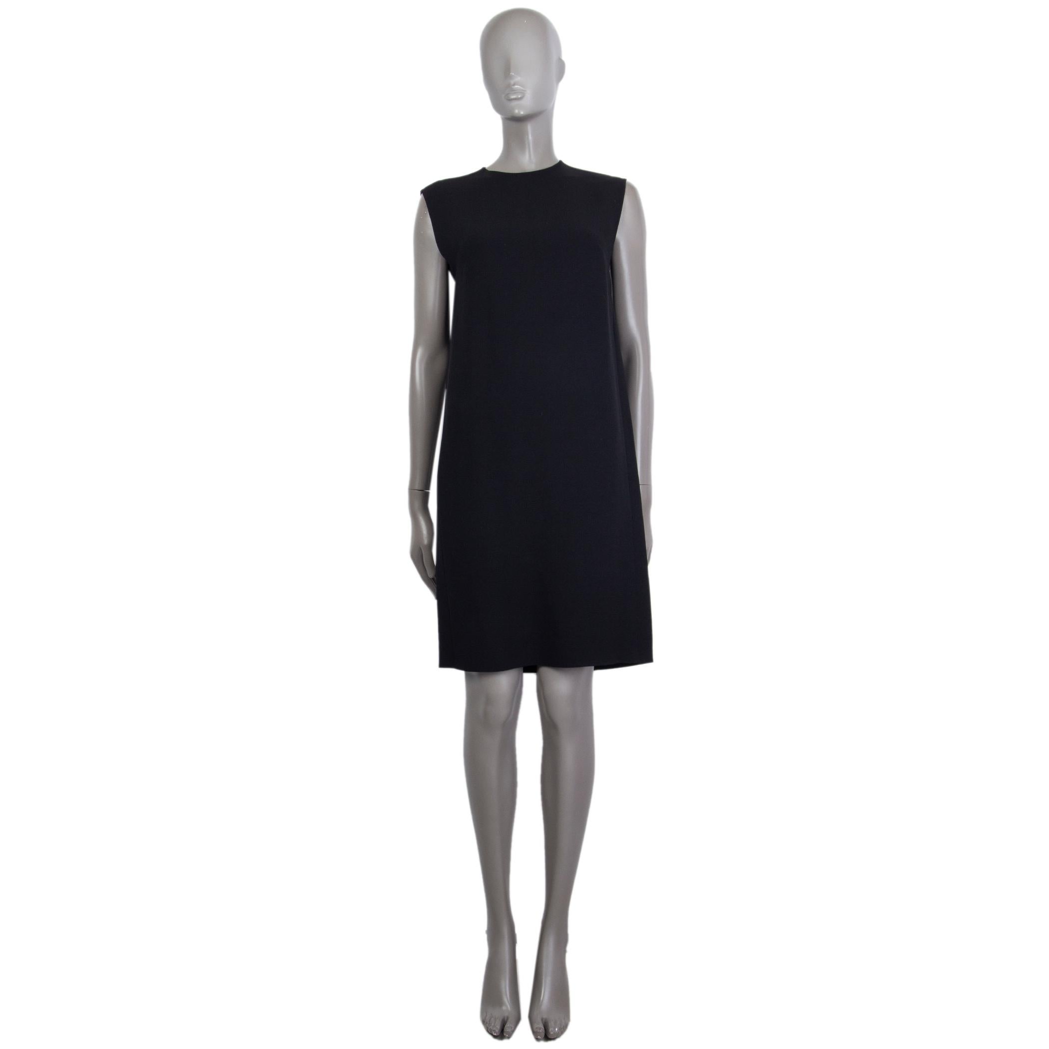 100% authentic Miu Miu shift dress in black missing tag (probably viscose) with a casual fit, straight cut, round neckline and sleeveless. Has a small cut-out in the back and closes with a hook and bar in the back. Unlined. Has been worn and in