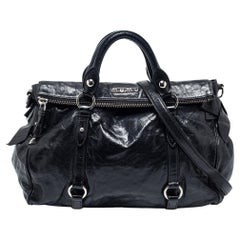 Miu Miu: schwarze Vitello Lux-Ledertasche mit Schleife