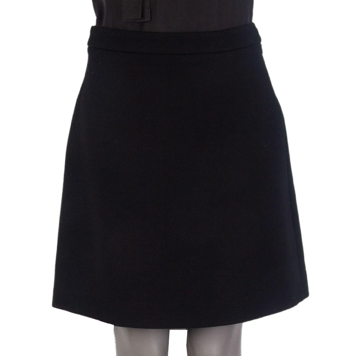 100% authentic Miu Miu A Line skirt in black virgin wool (100%). Closes with a hook and a concealed zipper on the side. Lined in black polyester (100%). Has been worn and is in excellent condition.

Tag Size 40
Size S
Waist 70cm (27.3in)
Hips 98cm