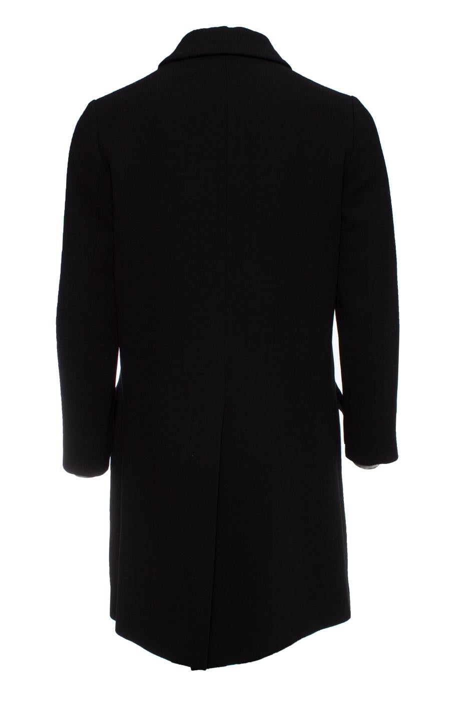 Miu Miu, Black wool coat with ruffles and push buttons. This item is in good condition.

• CONDITION: good condition

• SIZE: IT42 - S

• MEASUREMENTS: length 90 cm, width 47 cm, waist 50 cm, shoulder width 39 cm, arm length 55 cm

• FABRIC: 100%
