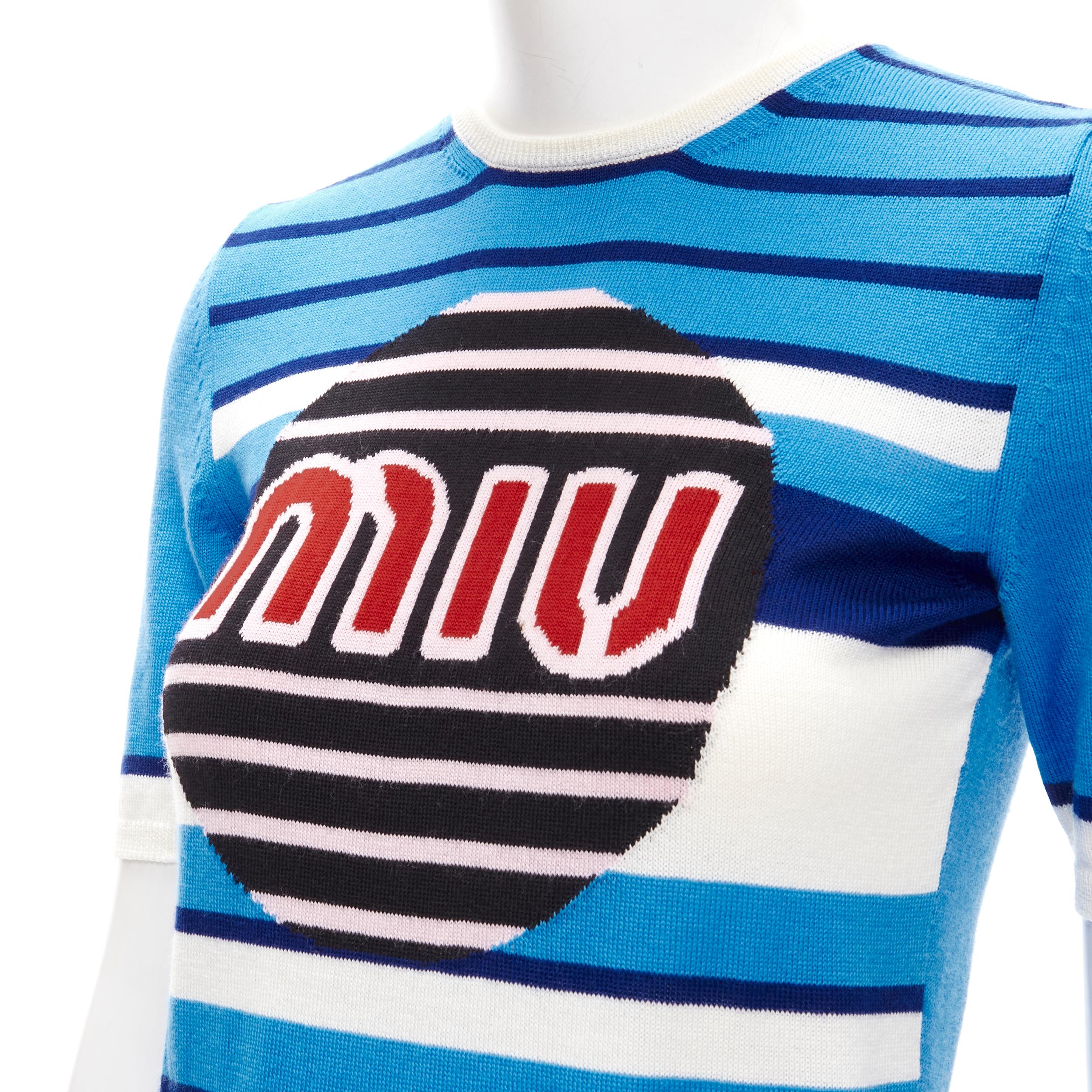 MIU MIU blue graphic circle logo striped knitted sweater top S 
Reference: ANWU/A00707 
Brand: Miu Miu 
Designer: Miuccia Prada 
Material: Feels like wool 
Color: Blue 
Pattern: Striped 
Made in: Italy 

CONDITION: 
Condition: Excellent, this item