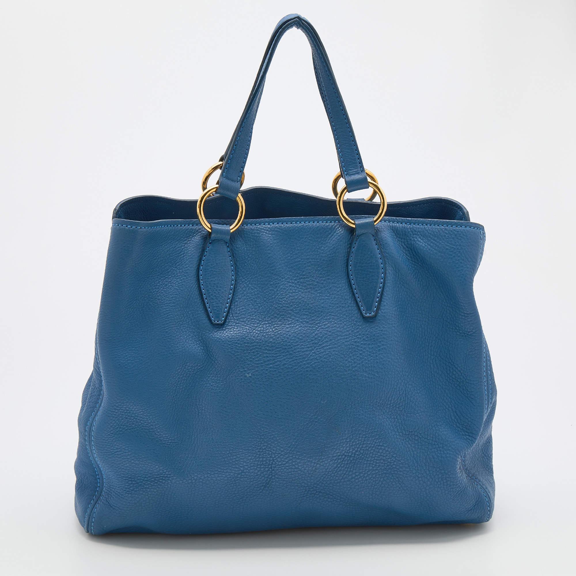Bringing a mix of timeless fashion and fine craftsmanship is this tote. The bag comes with a durable exterior, comfortable handles, shiny hardware, and a capacious interior. Fine elements complete the tote in a luxe way.

Includes: Original Dustbag,