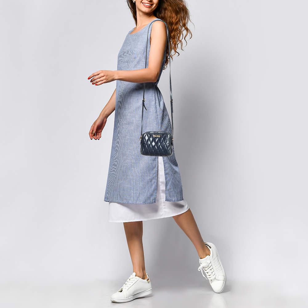 Designed to last this beautiful bag from Miu Miu is a prized buy. Comfortable and easy to carry this matelassé leather creation comes in blue with a gold tone logo detailing on the front and zip closures that open to satin lined compartments. It is