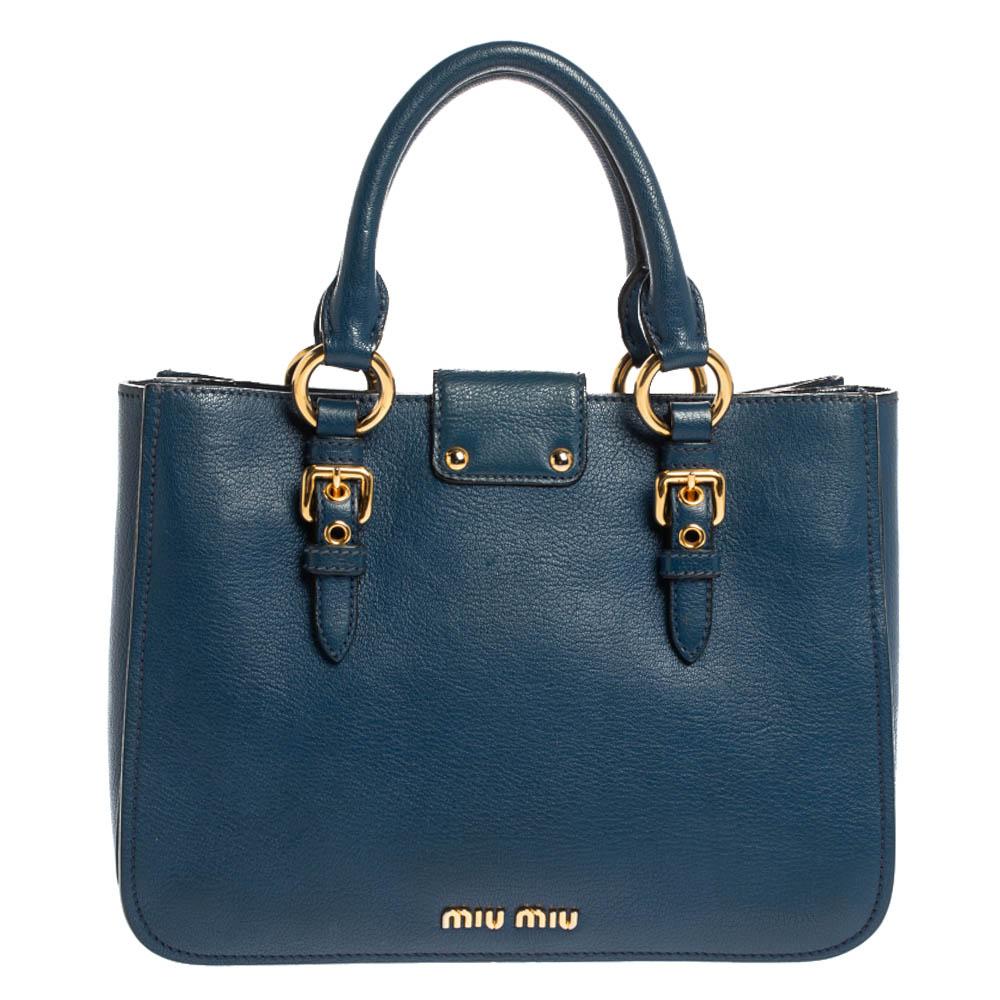 Fall in love with this quite in-vogue tote from Miu Miu. A fresh take on femininity, this bag stitched from blue textured leather is fabulous to elevate your evening ensembles. It has an equally splendid interior lined with fabric and features a