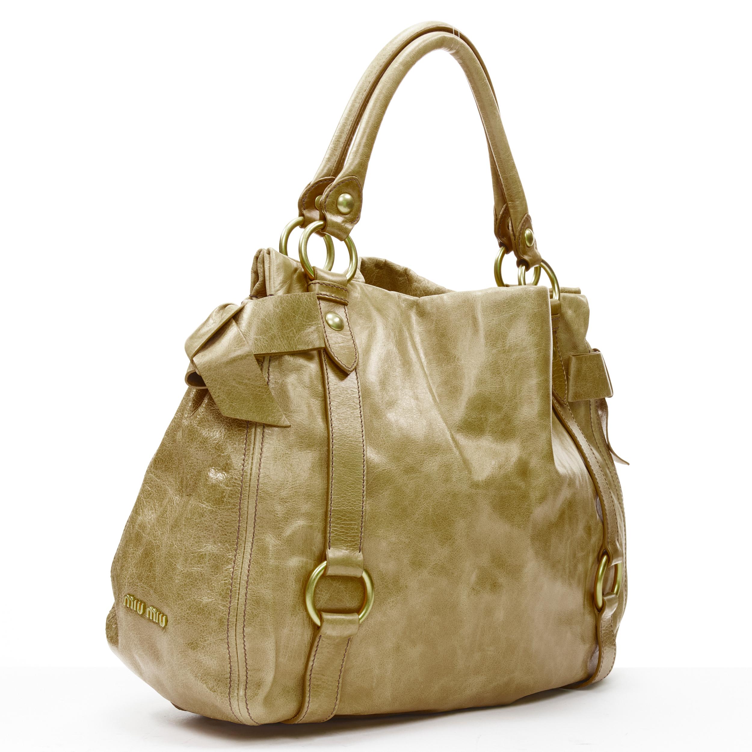Brown MIU MIU brown crinkled leather gold-tone strap bow detail hobo tote bag