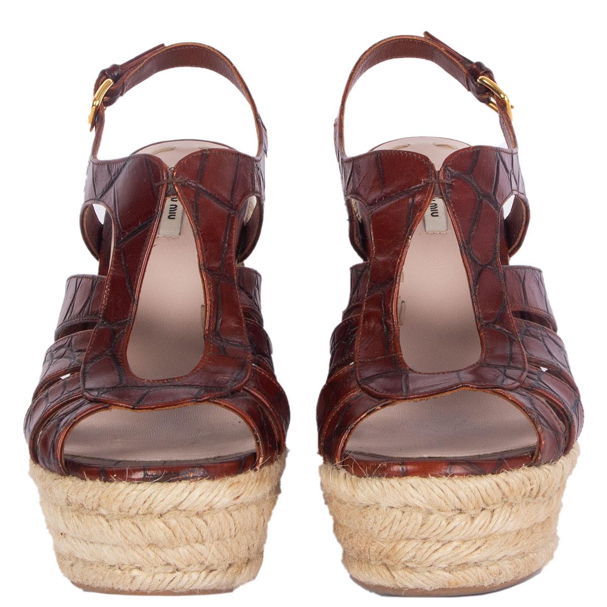 100% authentic Miu Miu espadrilles platform wedge sandals in cognac brown croco embossed leather. Have been worn and are in excellent condition. 

\
Imprinted Size	36.5
Shoe Size	36.5
Inside Sole	23.5cm (9.2in)
Width	8cm (3.1in)
Heel	11cm