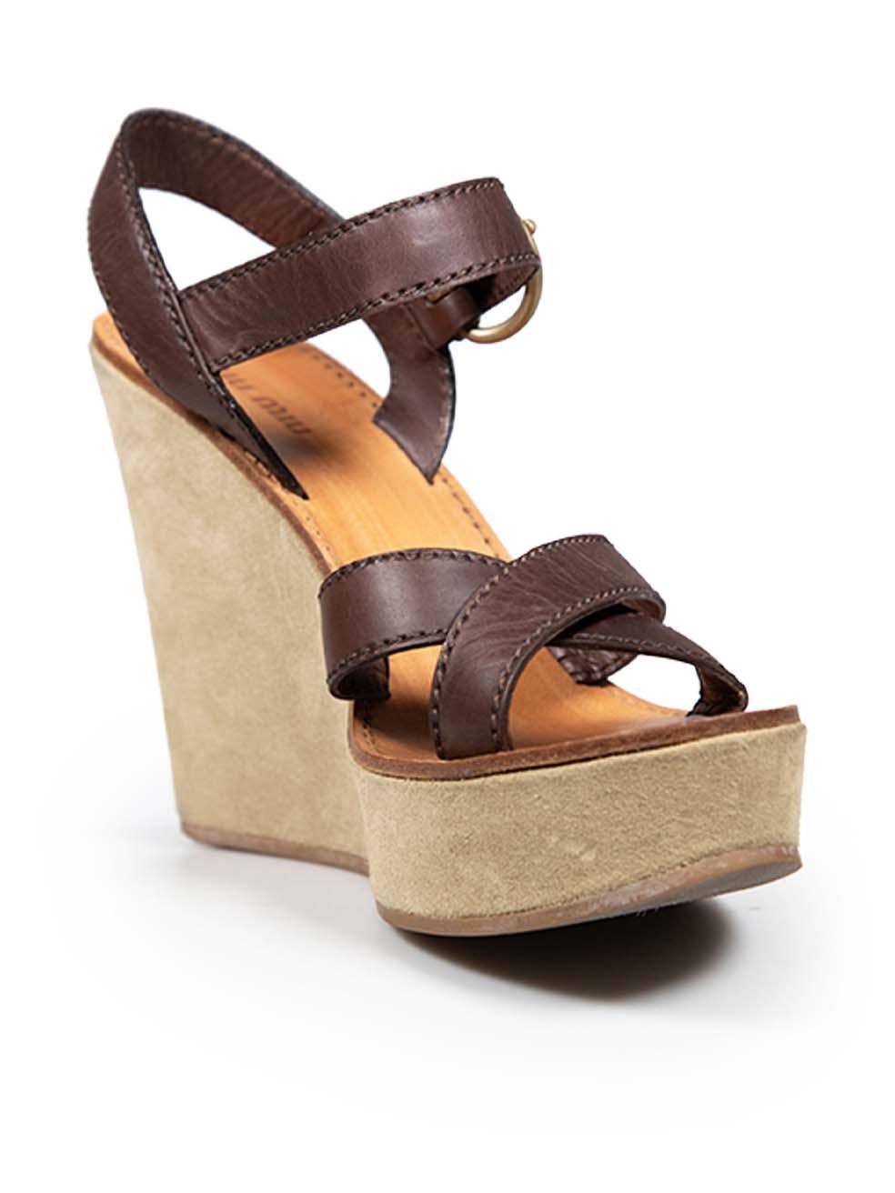 CONDITION is Very good. Minimal wear to shoes is evident. Light signs of wear to the leather that has warped, tarnishing on the buckle hardware, abrasion on the back of both shoes and fraying on the soles on this used Miu Miu designer resale item.
